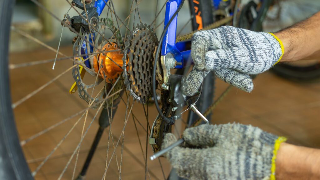 Cycle wheel and a pair of hands doing some work on it