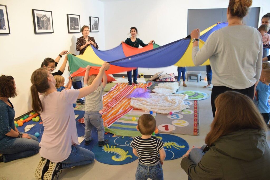 A play sessionwith a large cloth